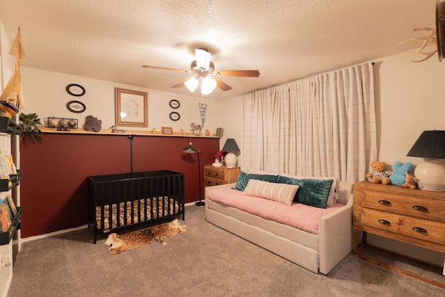6109 Elkhart Ave, Lubbock, TX 79424 - carpeted bedroom with a textured ceiling and a ceiling fan