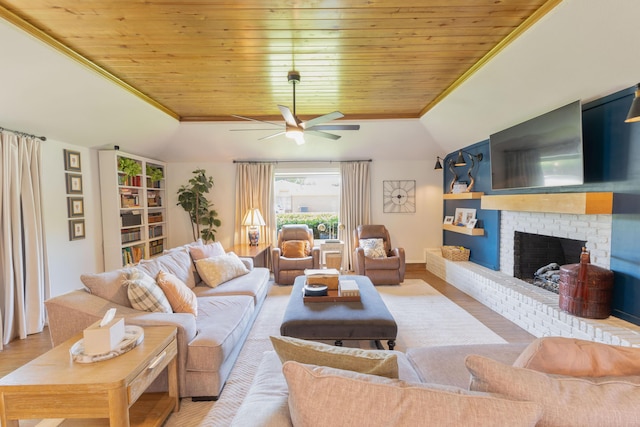 6109 Elkhart Ave, Lubbock, TX 79424 - living area featuring wooden ceiling, vaulted ceiling, ceiling fan, a fireplace, and wood finished floors