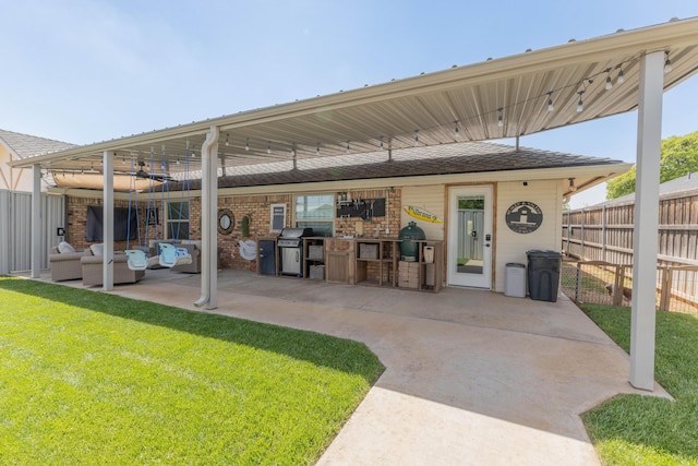 6109 Elkhart Ave, Lubbock, TX 79424 - view of patio featuring an outdoor kitchen and an outdoor living space
