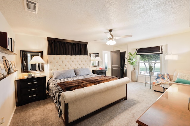 6109 Elkhart Ave, Lubbock, TX 79424 - bedroom with light colored carpet, a textured ceiling, and a ceiling fan
