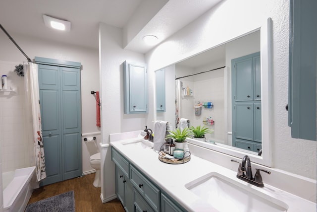6109 Elkhart Ave, Lubbock, TX 79424 - bathroom with double vanity, wood finished floors, and shower / tub combo with curtain