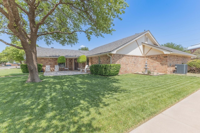 6109 Elkhart Ave, Lubbock, TX 79424 - single story home featuring brick siding, a front yard, a patio, roof with shingles, and stucco siding