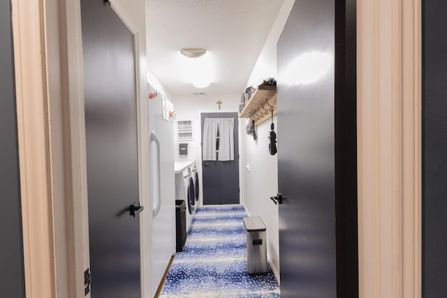 6109 Elkhart Ave, Lubbock, TX 79424 - corridor with washing machine and clothes dryer