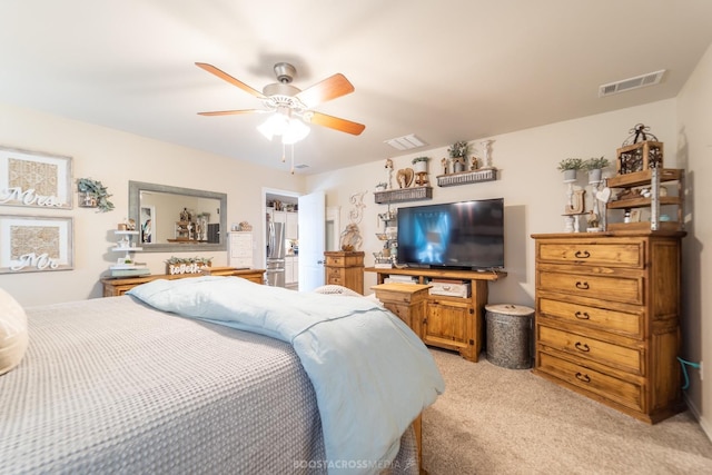 bedroom featuring ceiling fan and light carpet