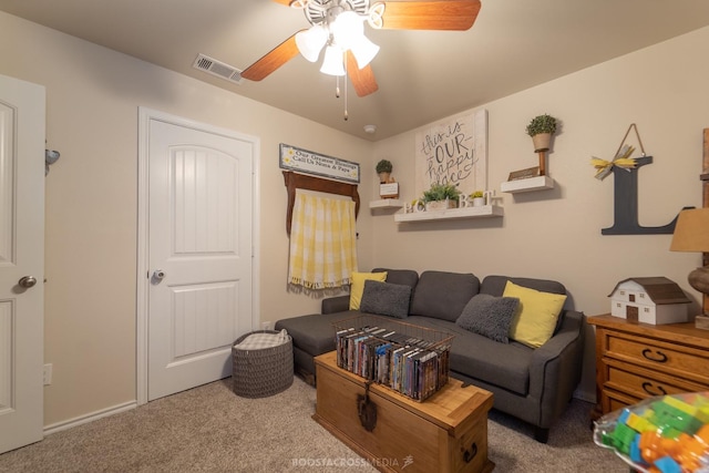 living room featuring ceiling fan and carpet flooring