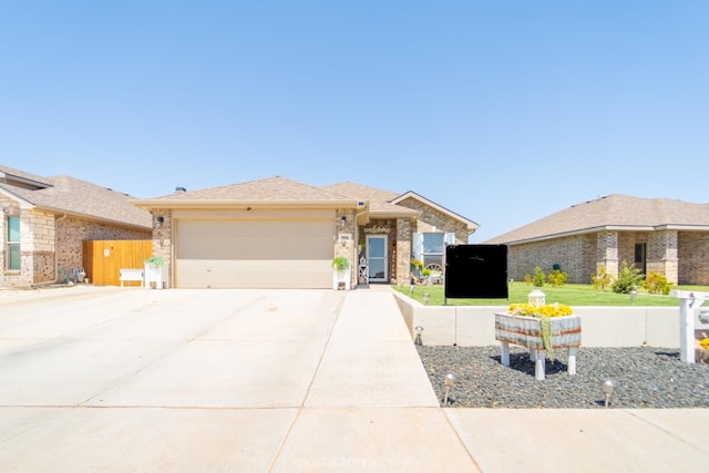 view of front of house featuring a garage and a front yard