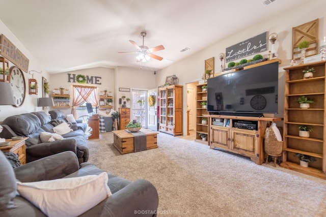 living room featuring vaulted ceiling, light colored carpet, and ceiling fan