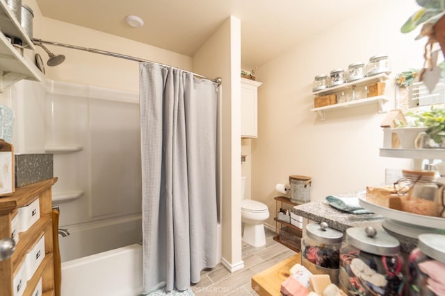 bathroom with shower / tub combo and toilet