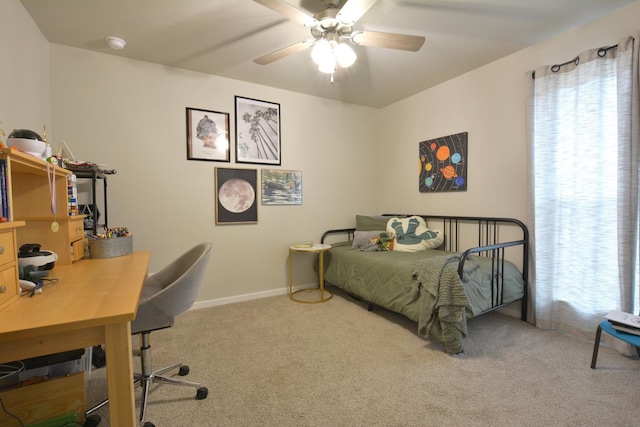 carpeted bedroom with multiple windows and ceiling fan