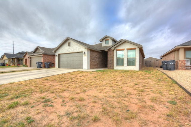 view of front of home featuring a garage and a front lawn