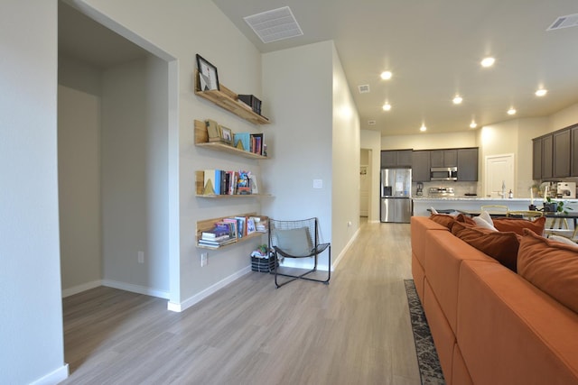 living room with light hardwood / wood-style flooring