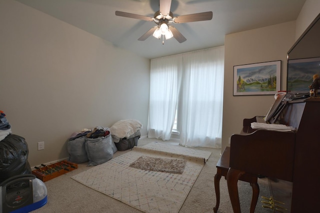 miscellaneous room featuring light carpet and ceiling fan