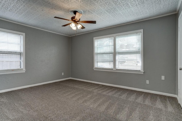 carpeted empty room featuring ornamental molding and ceiling fan