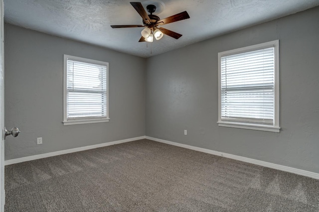 spare room with ceiling fan, carpet floors, and a textured ceiling