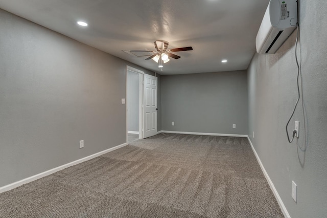 carpeted spare room with ceiling fan and a wall unit AC