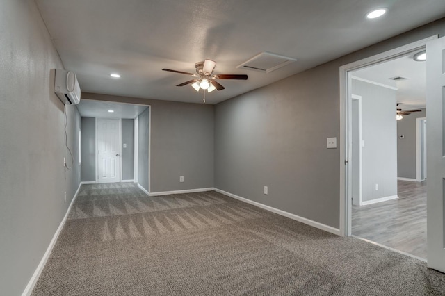 unfurnished room featuring a wall unit AC, ceiling fan, and carpet flooring