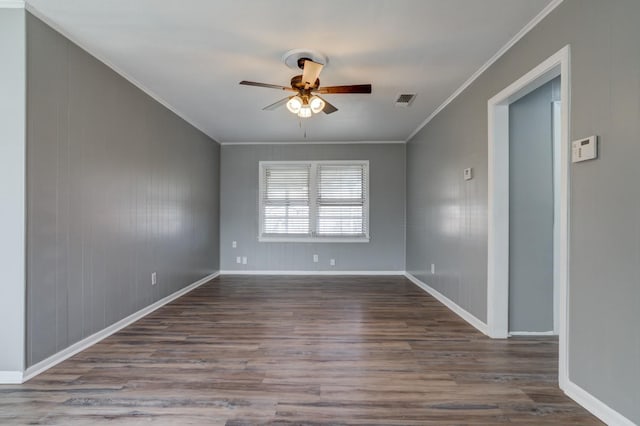 unfurnished room with hardwood / wood-style floors, ornamental molding, and ceiling fan