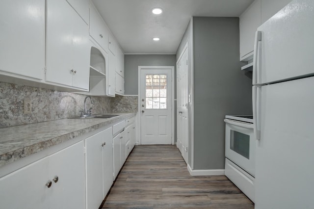 kitchen with sink, white appliances, dark hardwood / wood-style floors, white cabinets, and decorative backsplash