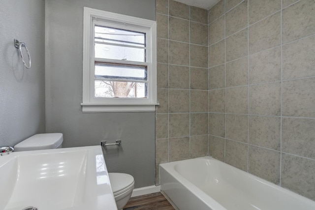 bathroom with sink, wood-type flooring, and toilet