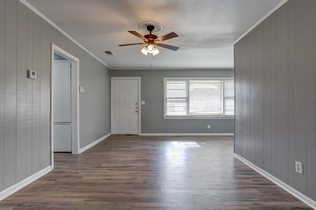 interior space featuring crown molding, ceiling fan, and dark hardwood / wood-style flooring