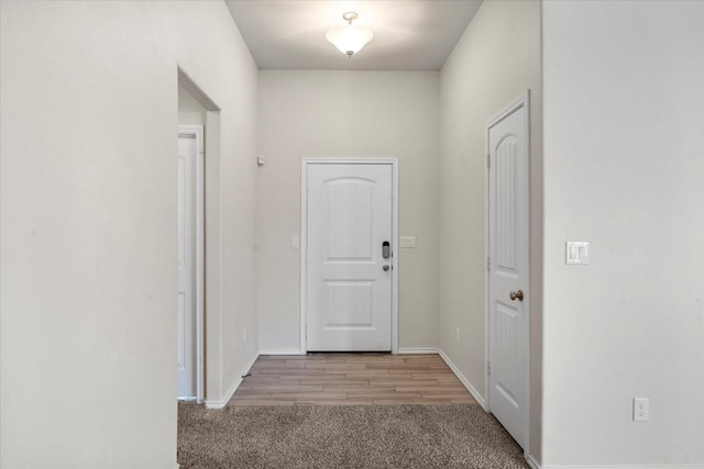 corridor with light carpet