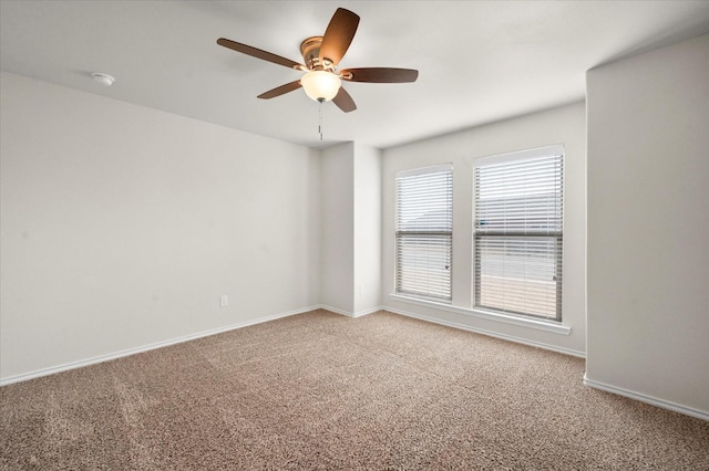 carpeted empty room with ceiling fan