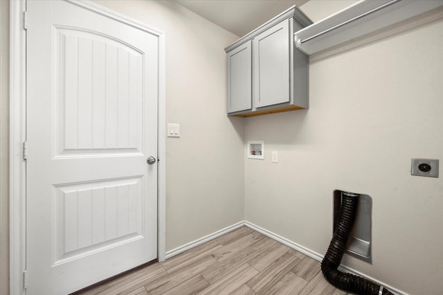 laundry room featuring hookup for a washing machine, electric dryer hookup, cabinets, and light wood-type flooring