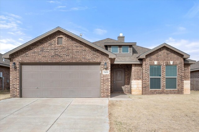 view of front of property with a garage