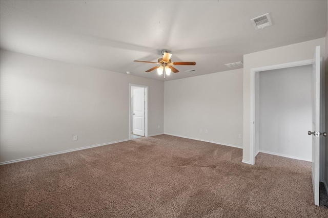 unfurnished room featuring ceiling fan and carpet