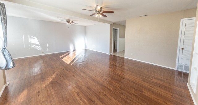 spare room featuring dark hardwood / wood-style floors and ceiling fan