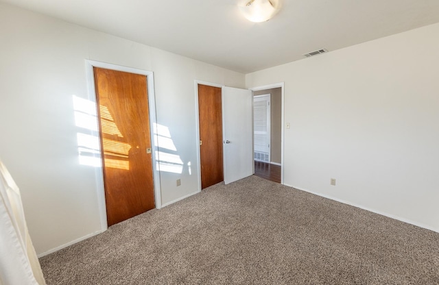 unfurnished bedroom with carpet flooring