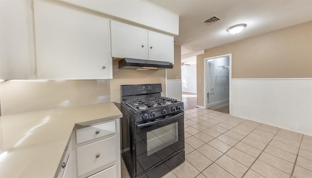 kitchen featuring white cabinetry, black range with gas cooktop, and light tile patterned floors