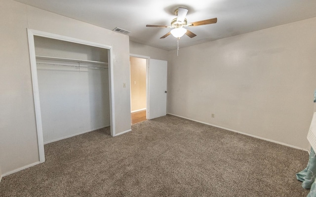 unfurnished bedroom with carpet floors, a closet, and ceiling fan