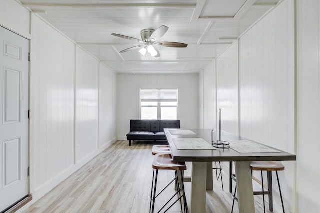 dining area with ceiling fan and light wood-type flooring