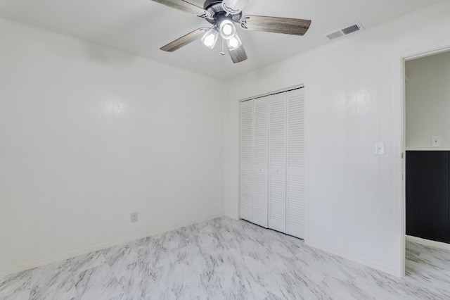 unfurnished bedroom with a closet and ceiling fan