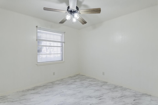 spare room with ceiling fan