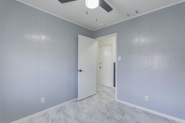 unfurnished room with crown molding and ceiling fan