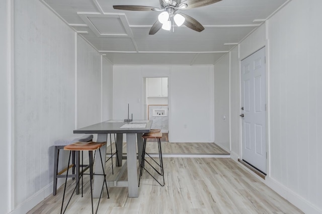 dining space with ceiling fan and light hardwood / wood-style floors