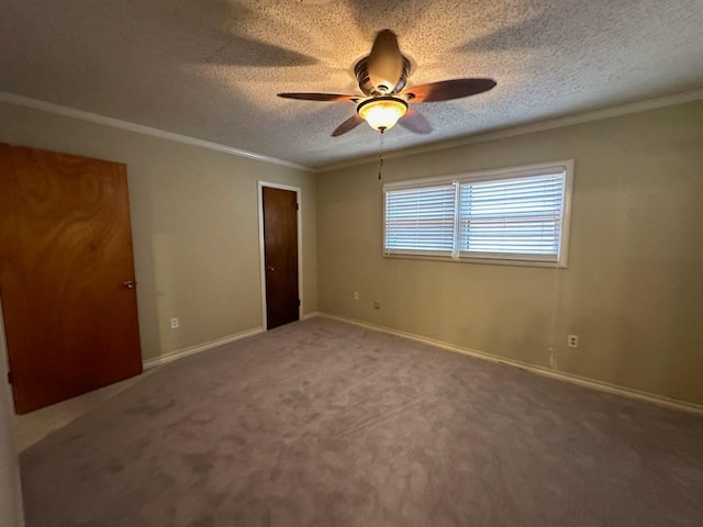 unfurnished bedroom featuring ornamental molding, carpet, ceiling fan, and a textured ceiling