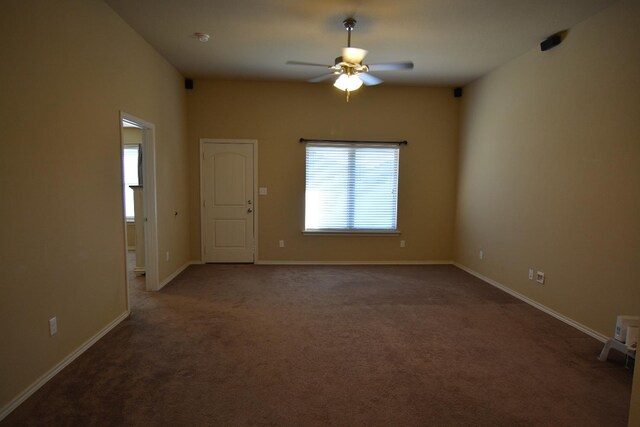 carpeted empty room featuring ceiling fan