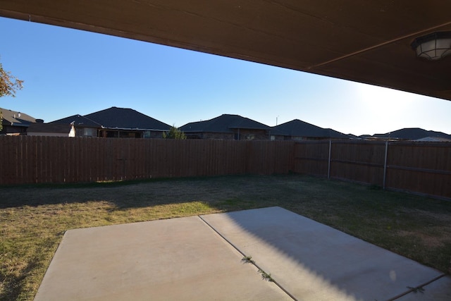 view of yard with a patio and a mountain view