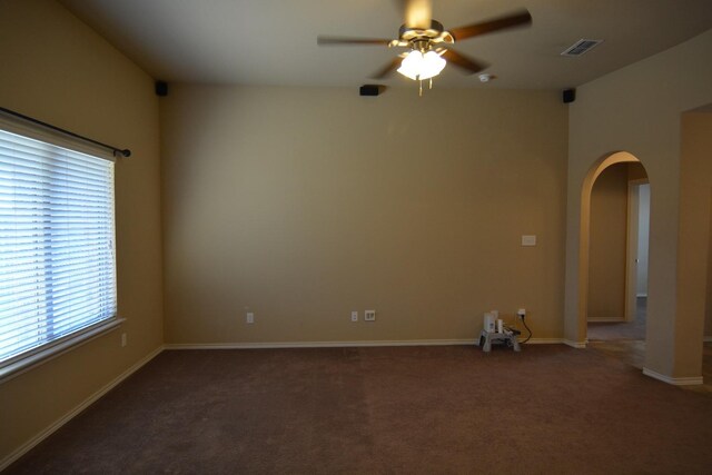 carpeted empty room featuring ceiling fan