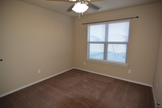 carpeted empty room featuring ceiling fan