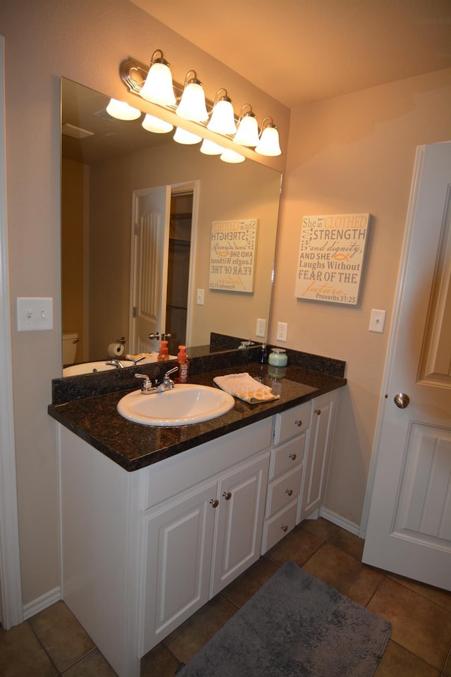 bathroom with tile patterned floors and vanity