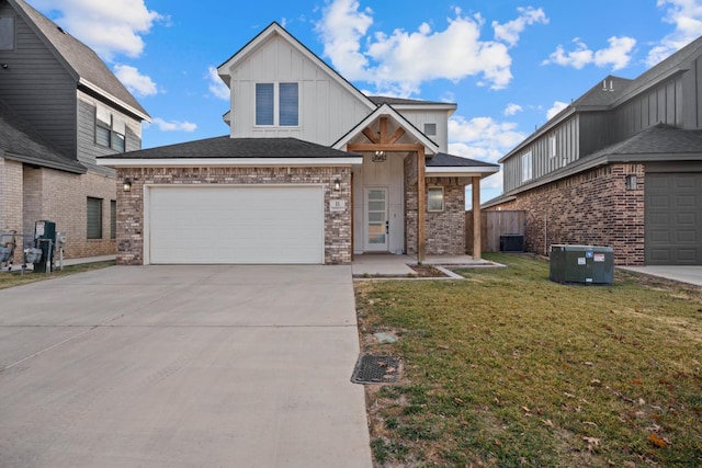 view of front of property with cooling unit, a garage, and a front lawn