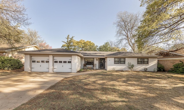 ranch-style home featuring driveway, brick siding, and a garage