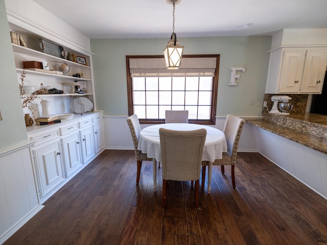 dining area featuring dark wood finished floors