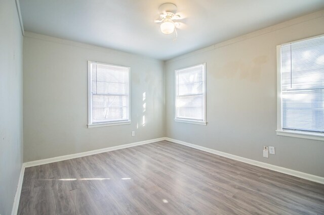 unfurnished room with hardwood / wood-style floors