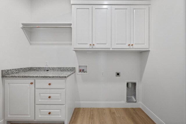 bathroom featuring hardwood / wood-style floors, vanity, a washtub, and tile walls