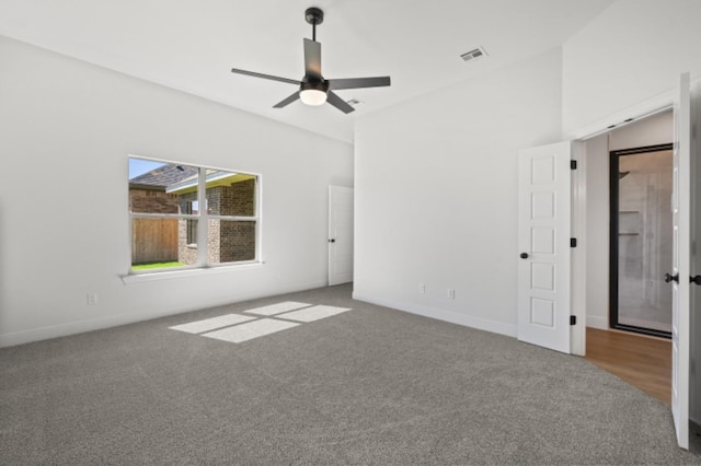 empty room with carpet floors and ceiling fan